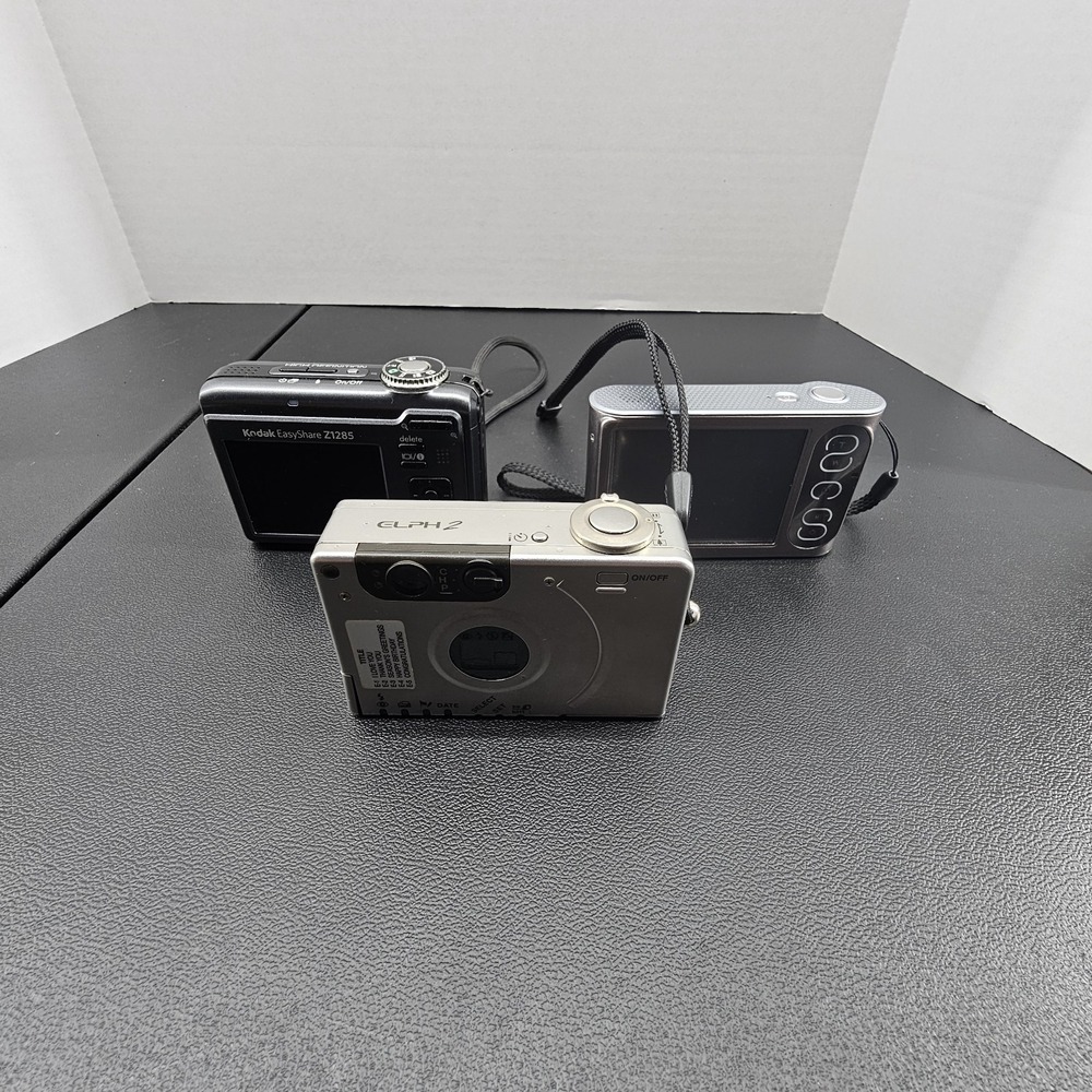 digital camera lot cannon,kodak,polaroid With Random Camera User Guides Un Teste